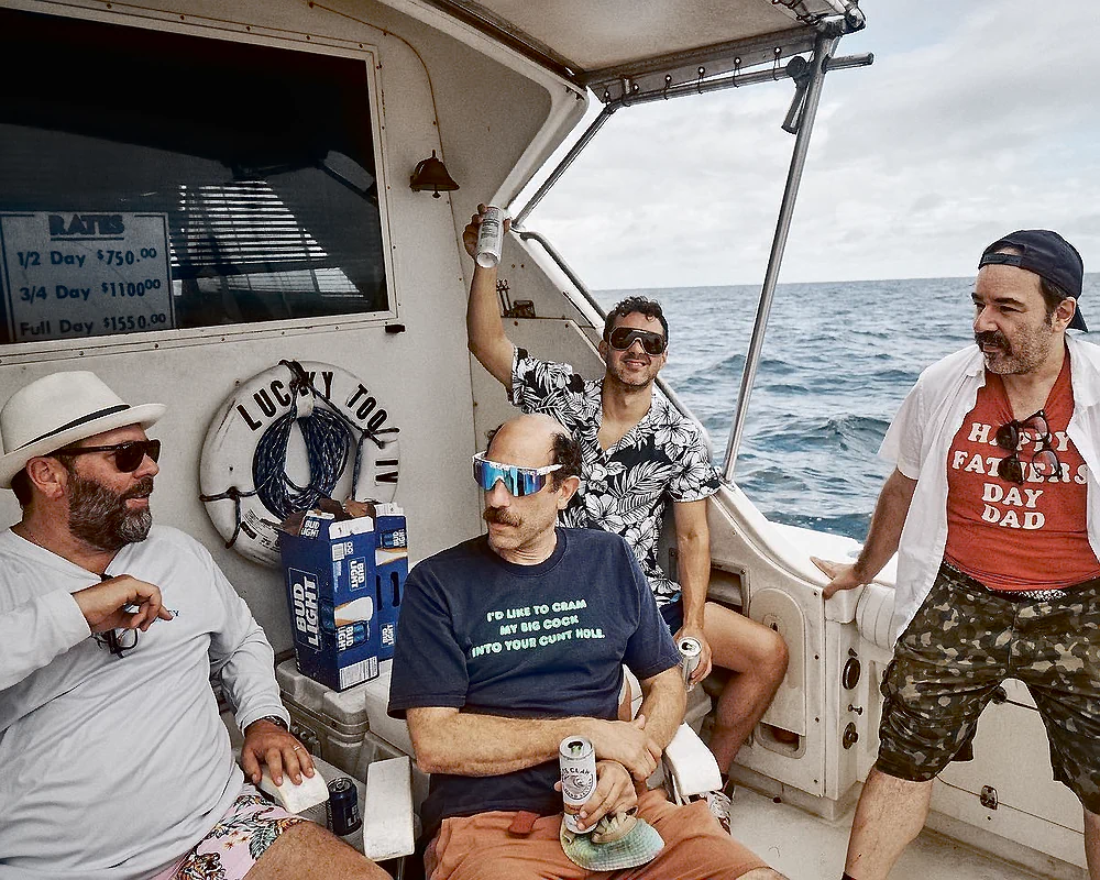 Comedians Bert Kreischer and Ari Shaffir with photographer Matt Salacuse fishing on a fishing boat with Comedian Mark Normand of Tuesdays with Stories. Find more about Mark at www.tuesdayspod.com/mark-normand