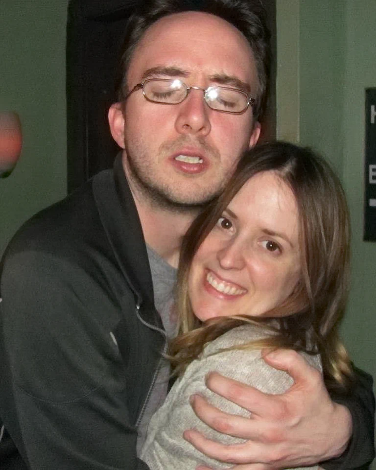 Comedian Joe List of Tuesdays with Stories hugging his wife, comedian Sarah Tollemache. Find more about Joe and Sarah at www.tuesdayspod.com/joe-list