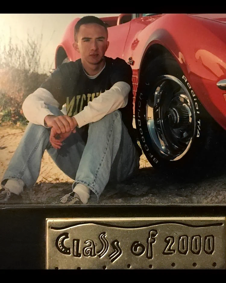 Red Corvette Class of 2000 graduation picture of comedian Joe List of Tuesdays with Stories. Find more about Joe at www.tuesdayspod.com/joe-list