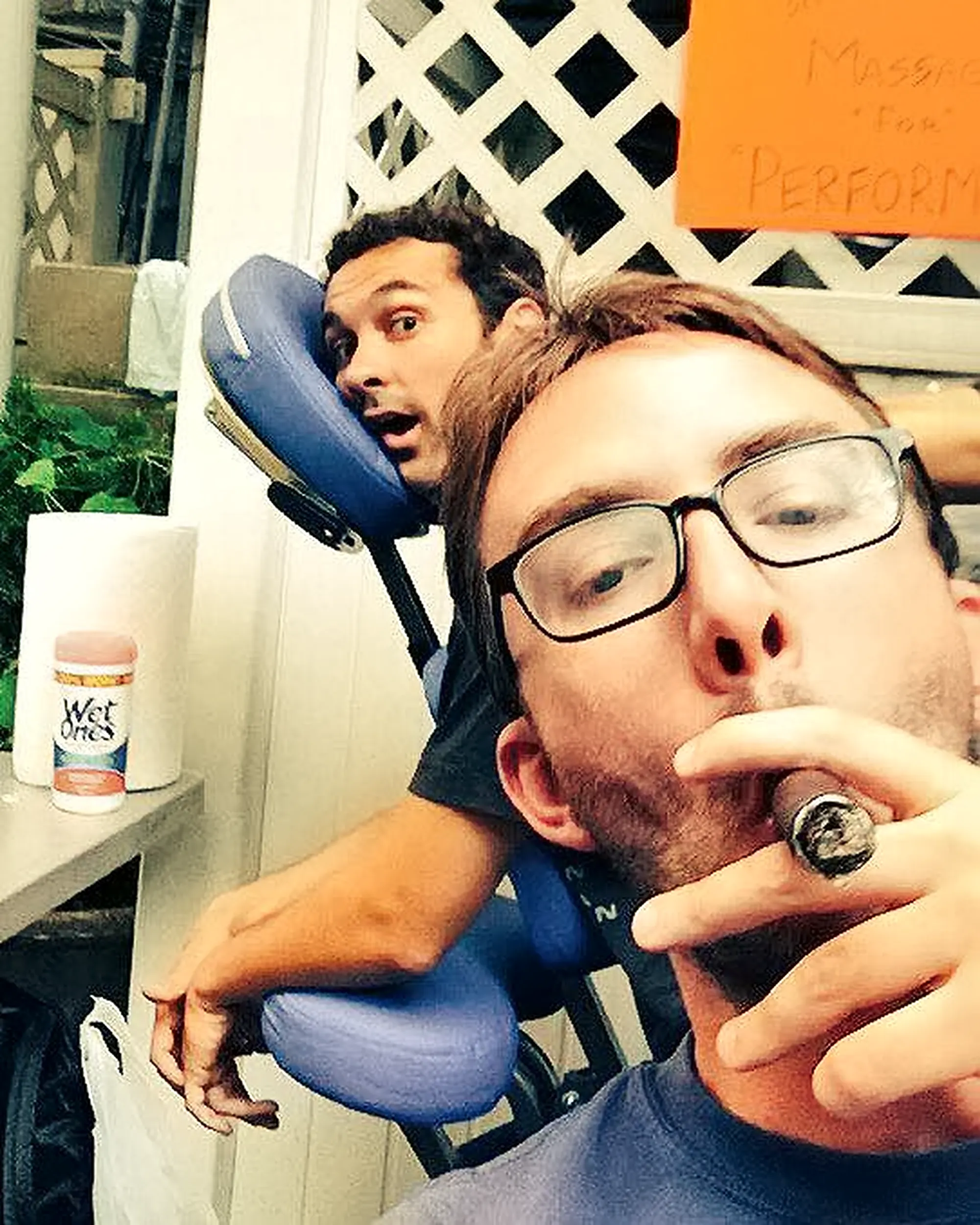 Comedian Joe List smoking a cigar with comedian Mark Normand, hosts of Tuesdays with Stories. Find Mark Normand Tour Dates and Joe List Tour Dates at www.tuesdayspod.com/find-a-show