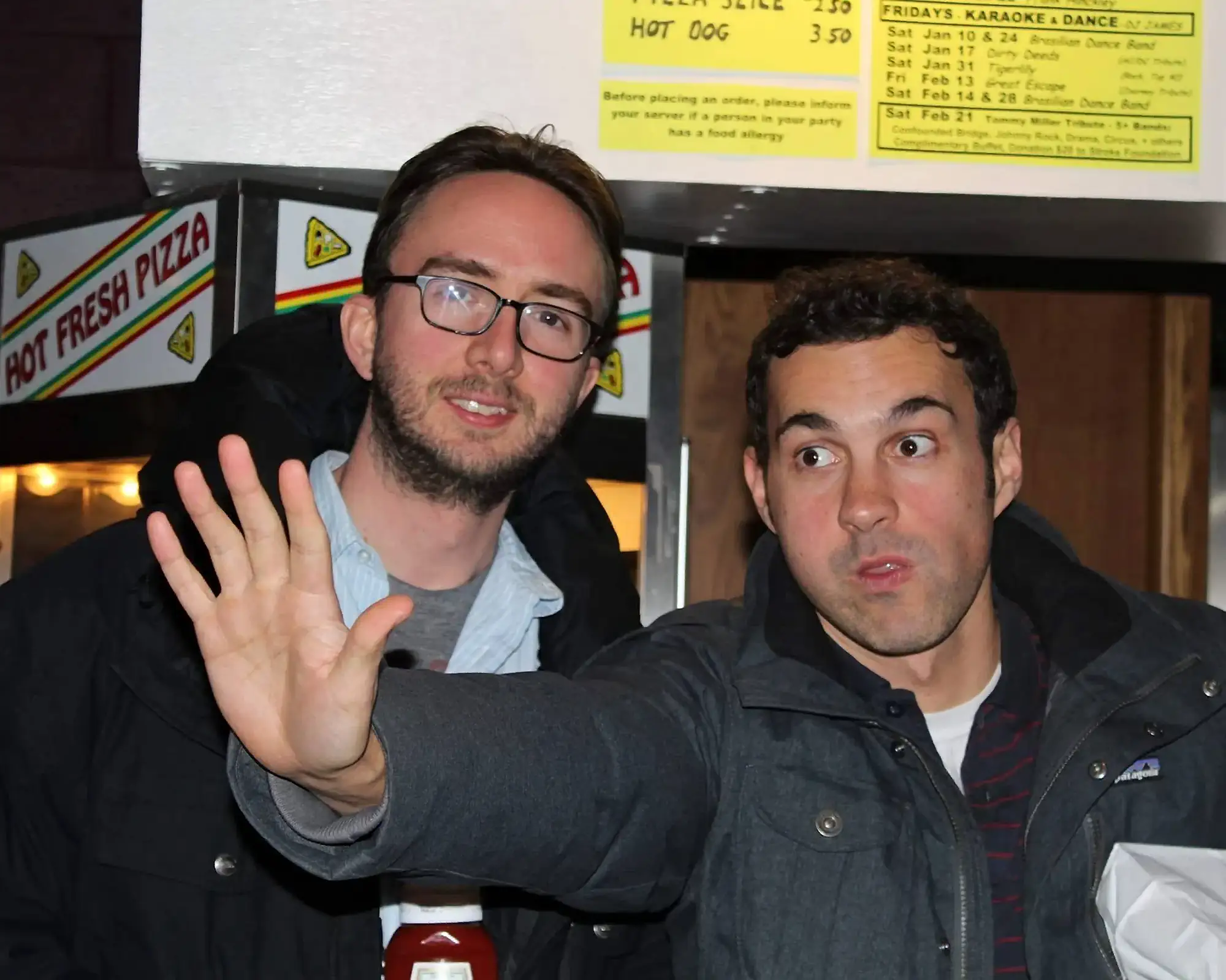 Comedians Mark Normand and Joe List of Tuesdays with Stories taking a picture together while Mark says stop. Find Mark Normand Tour Dates and Joe List Tour Dates at www.tuesdayspod.com/find-a-show