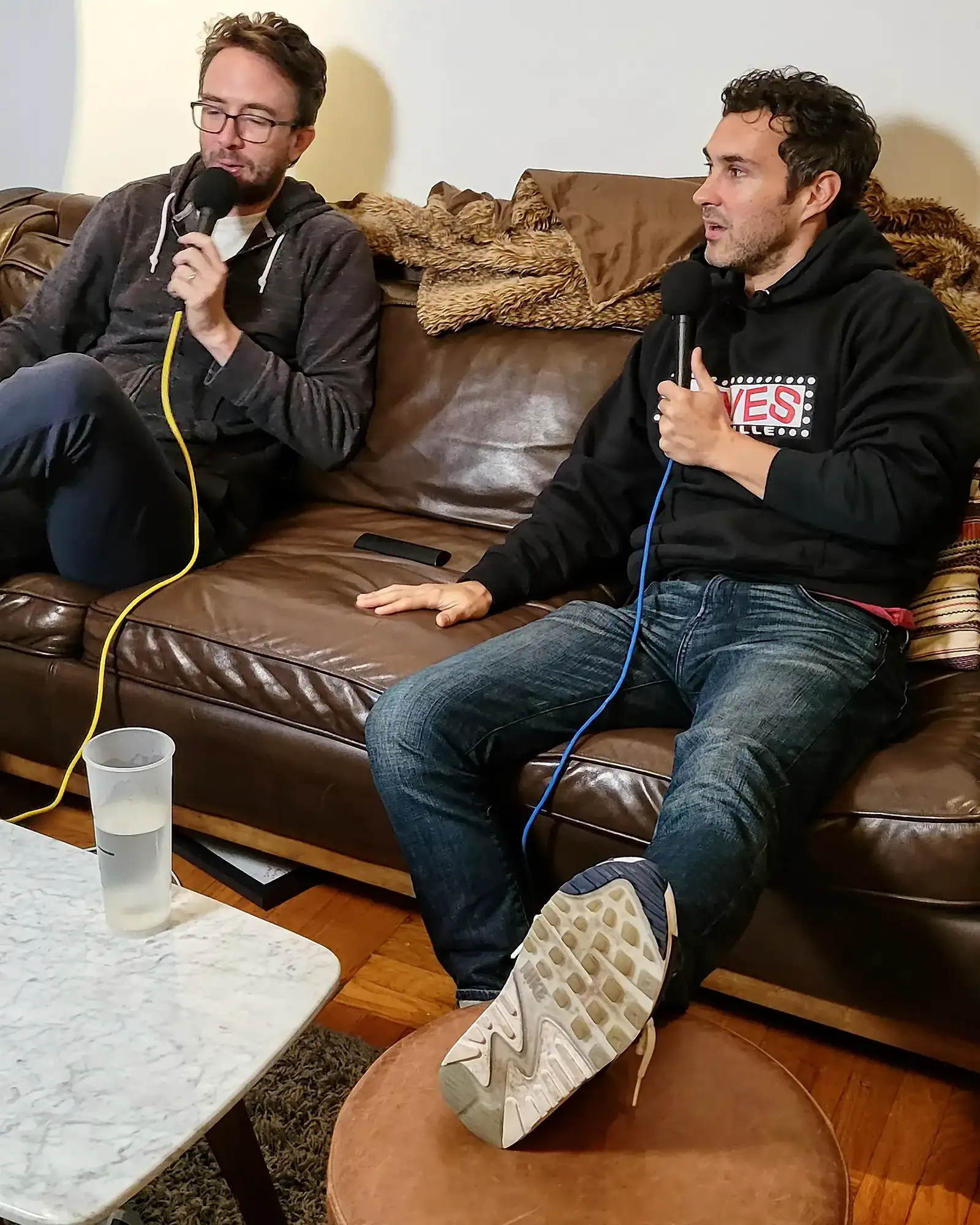 Comedians Mark Normand and Joe List of Tuesdays with Stories on the couch. Find Mark Normand Tour Dates and Joe List Tour Dates at www.tuesdayspod.com/find-a-show