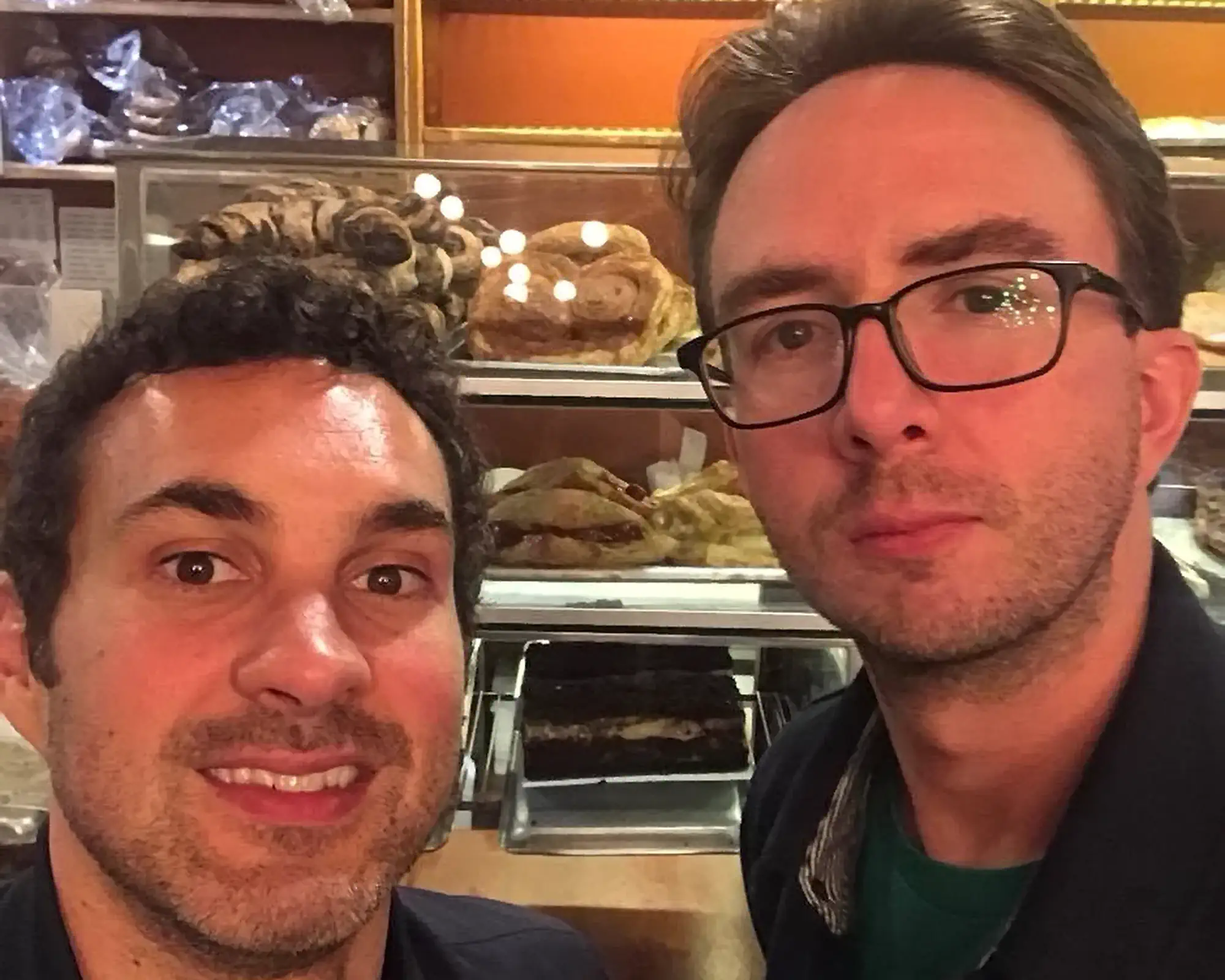 Comedians Mark Normand and Joe List of Tuesdays with Stories at the Bakery taking a selfie. Find Mark Normand Tour Dates and Joe List Tour Dates at www.tuesdayspod.com/find-a-show